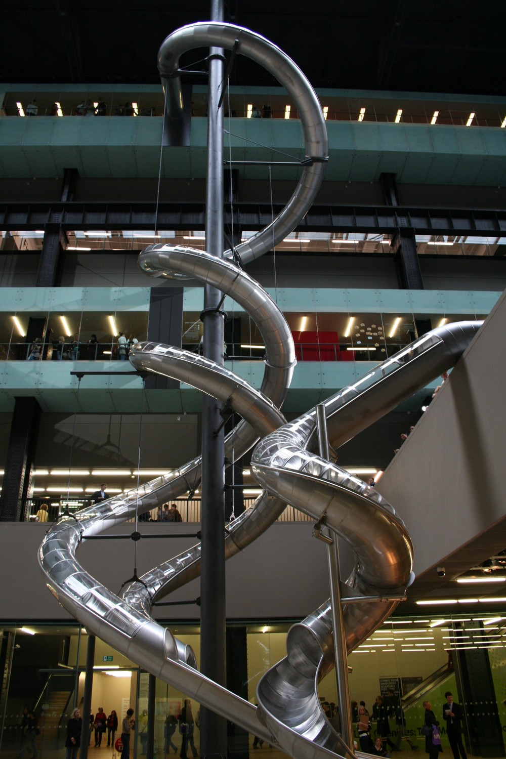 Carsten Höller’s spiralling metal slides cross the Turbine Hall at Tate Modern